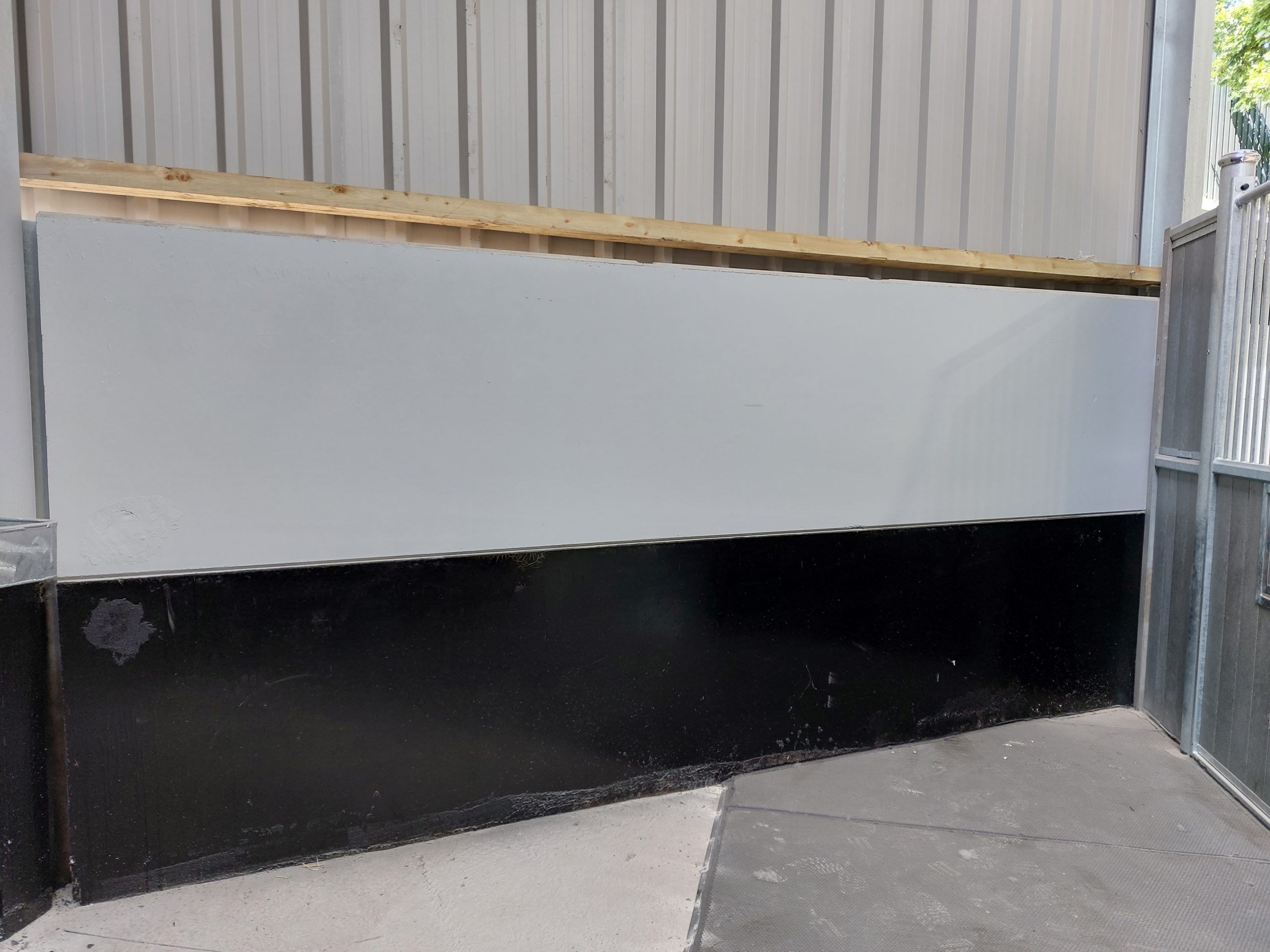Painted concrete panels in equestrian building in Cheshire